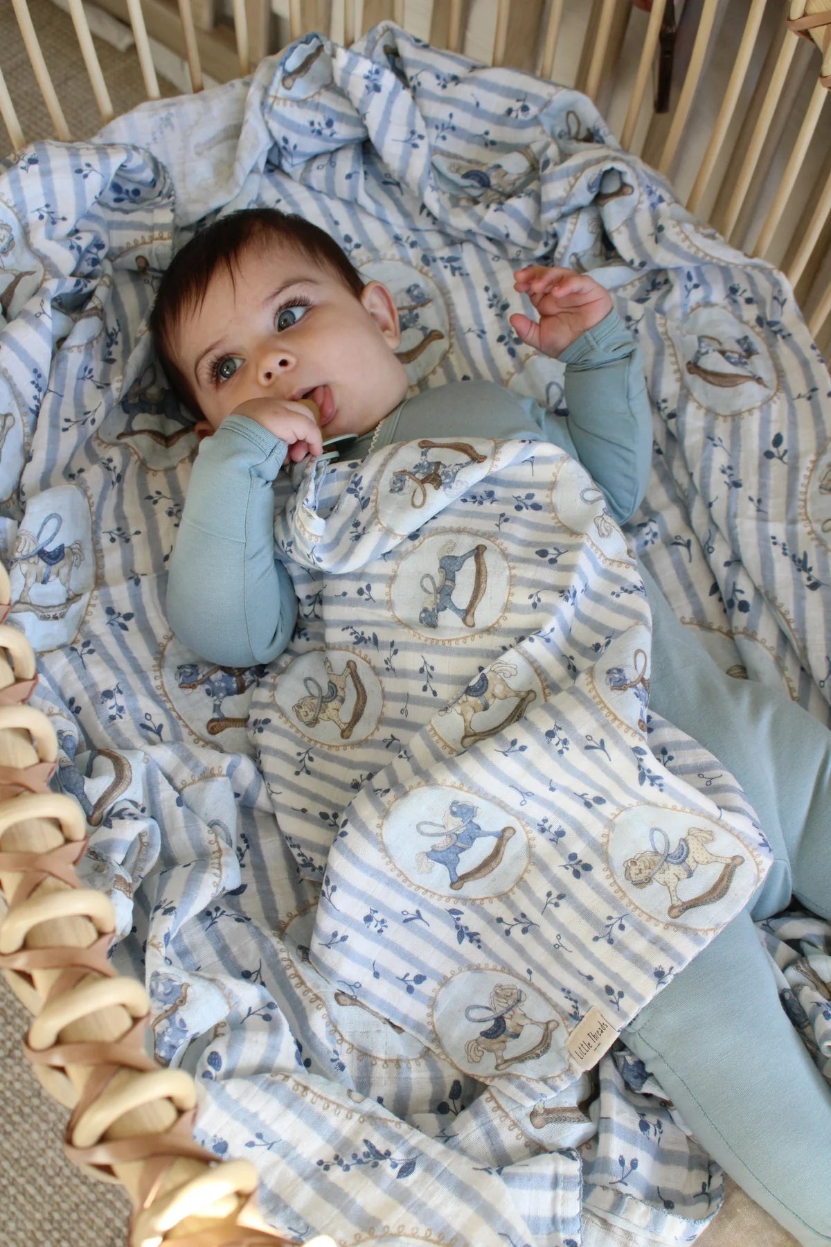 BLUE ROCKING HORSE MUSLIN BLANKET